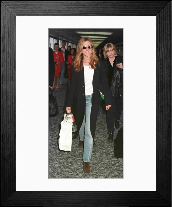 Framed Print : Jennifer Aniston actress arriving at Heathrow from Los Angeles