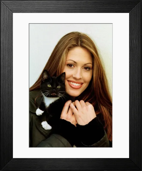 Framed Print : Nicola Charles Neighbours actress and kitten January 1998 Nicola cuddles Poppy