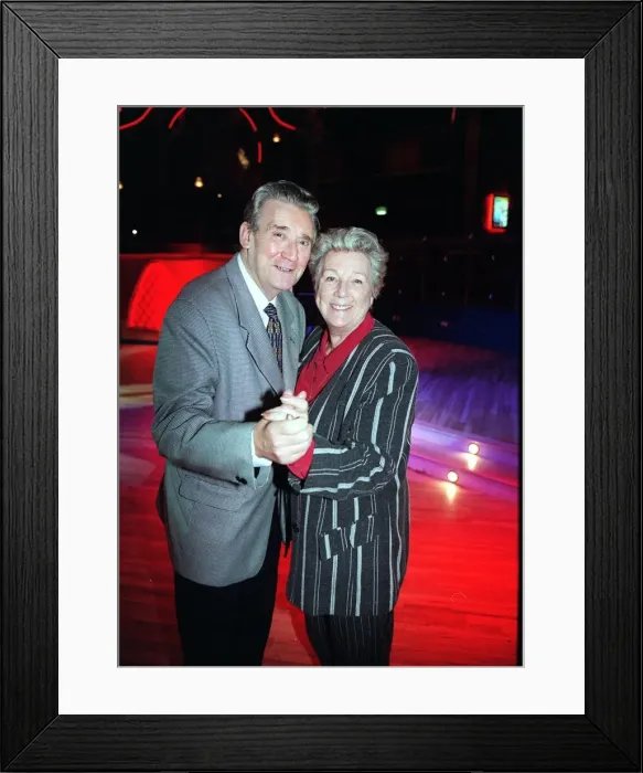 Framed Print : Bryan Mosley actor December 1998 dancing with wife Norma at a Christmas Party