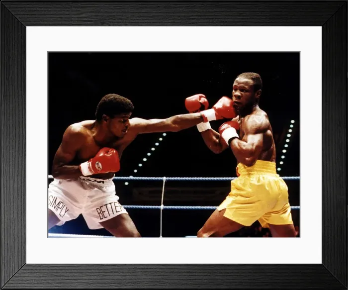 Framed Print : Chris Eubank Boxer takes a left jab from his opponent during their fight in Birmingham Framed Print : Chris Eubank Boxer takes a left jab from his opponent during their fight in Birmingham