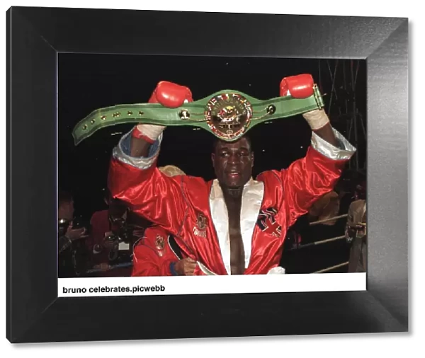 Frank Bruno celebrates after defeating Oliver McCall for the heavyweight title