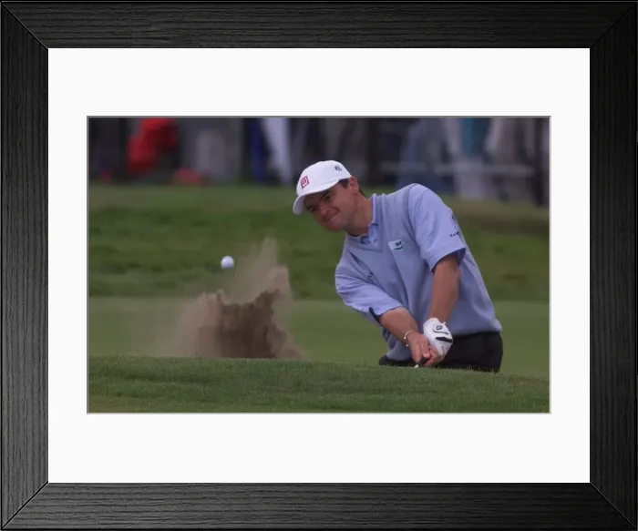 Framed Print : Paul Lawrie plays out of a bunker on the 18th green July 1999 Framed Print : Paul Lawrie plays out of a bunker on the 18th green July 1999