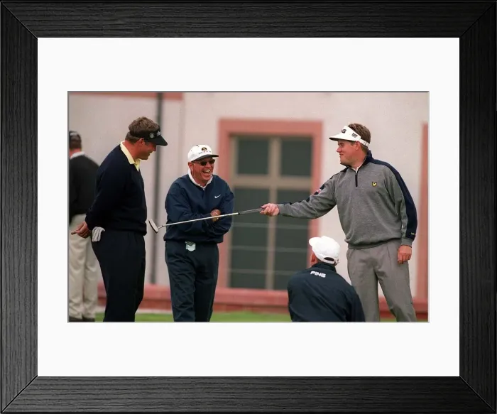 Framed Print : Englands Lee Westwood pokes his putter into Darren Clarke Framed Print : Englands Lee Westwood pokes his putter into Darren Clarke