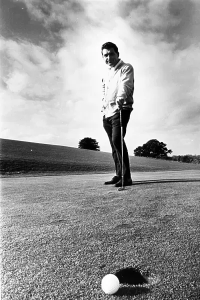 David Lewis Nov 1967 golf professional at East Hert golf club contemplates missed putt