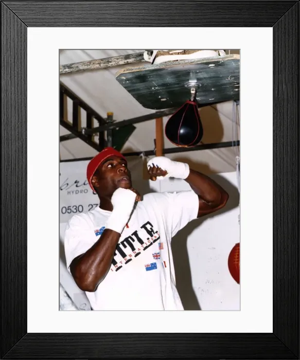 Framed Print : Frank Bruno boxer training with a speed ball