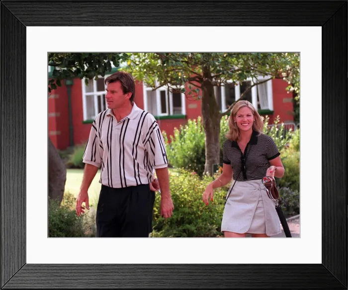 Framed Print : Nick Faldo Golfer with his girlfriend Brenna Cepelak by the clubhouse after his second Framed Print : Nick Faldo Golfer with his girlfriend Brenna Cepelak by the clubhouse after his second