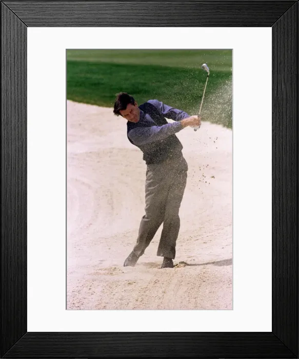 Framed Print : Nick Faldo Golf drives out of a fairway bunker during the Pro Am at The Oxfordshire Golf