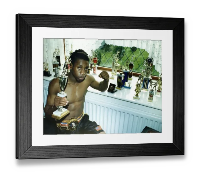 Framed Print : Pat Barrett the professional Welter weight boxer sits alongside his trophies Framed Print : Pat Barrett the professional Welter weight boxer sits alongside his trophies