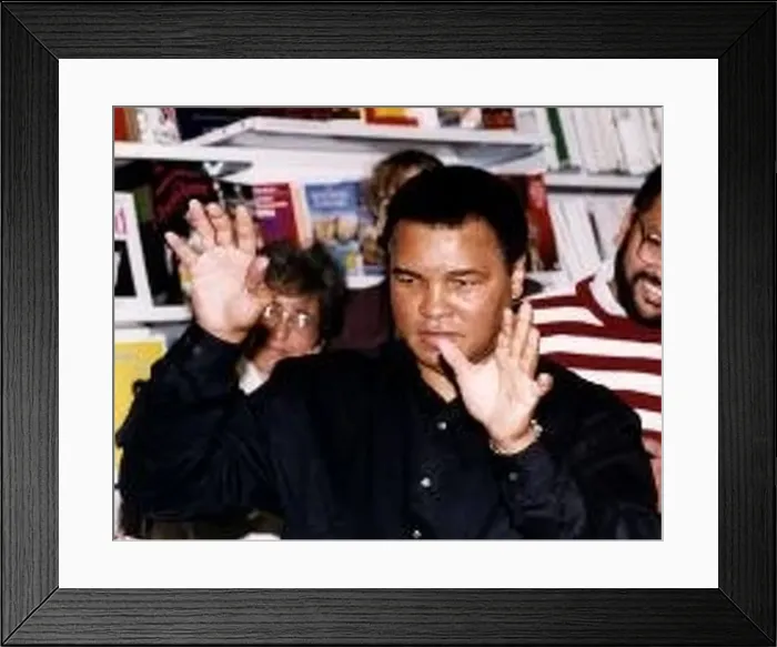 : Muhammad Ali (Cassius Clay) former world heavyweight boxing champion with hands up at W : Muhammad Ali (Cassius Clay) former world heavyweight boxing champion with hands up at W