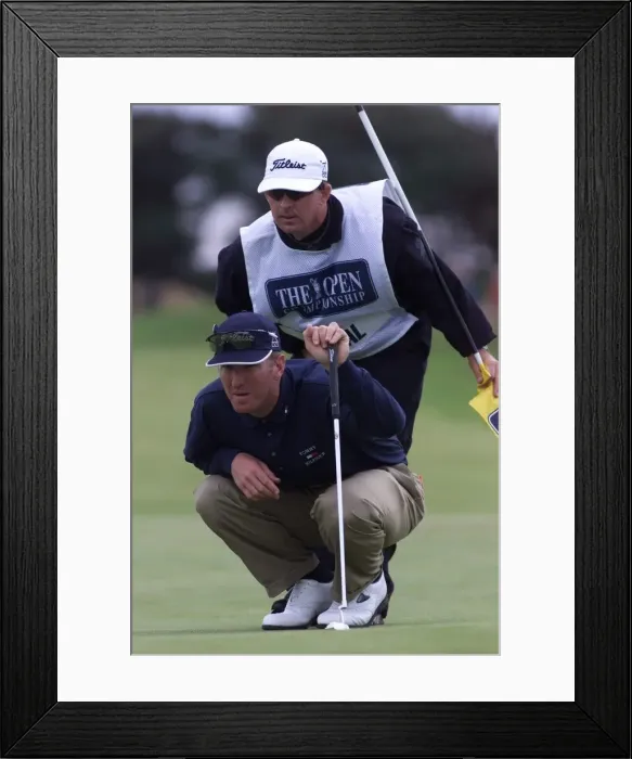 Framed Print : David Duval lines up a putt with his caddie July 1999 on the 11th green during Framed Print : David Duval lines up a putt with his caddie July 1999 on the 11th green during