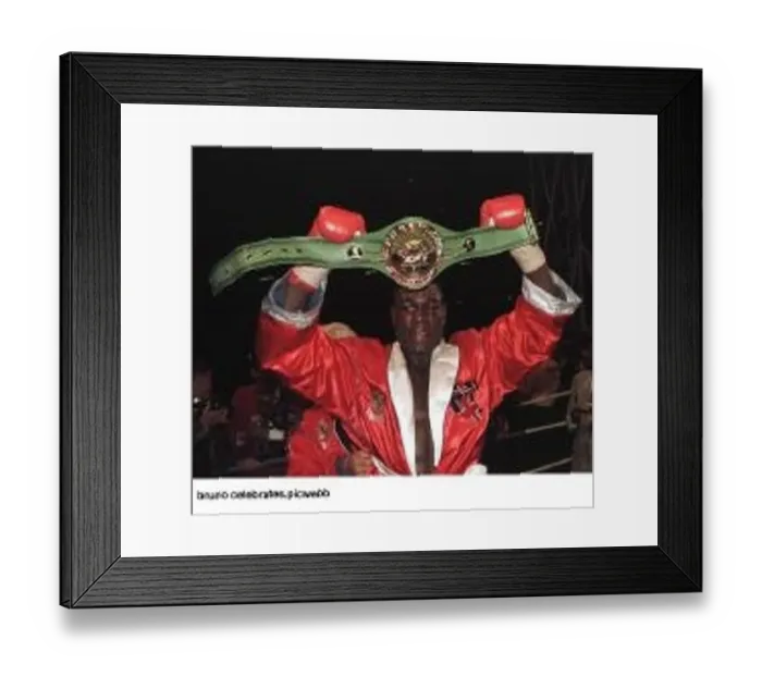 : Frank Bruno holds up his WBC world title belt after he had beaten Oliver McCall in his : Frank Bruno holds up his WBC world title belt after he had beaten Oliver McCall in his