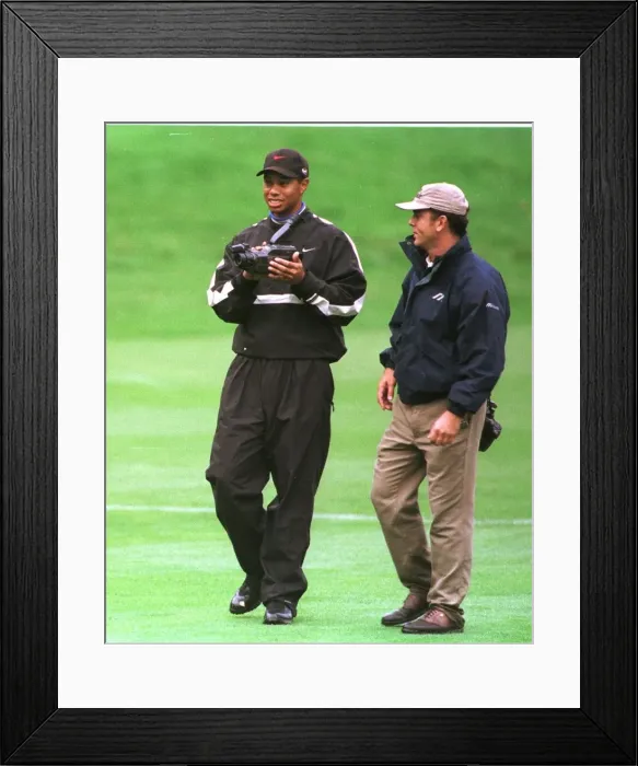 Framed Print : Tiger Woods watches his swing on video October 1998 during his practice round in