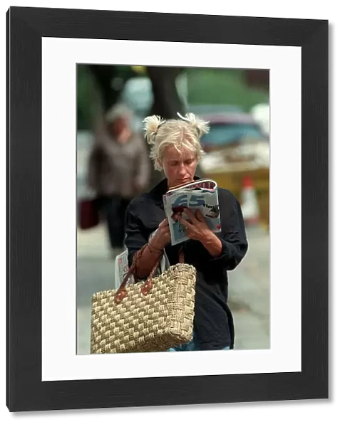 Paula Yates TV Presenter August 1998 Walking down the street reading a magazine