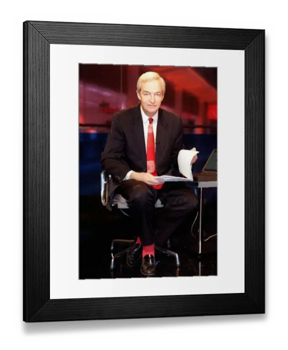 Framed Print : Jon Snow TV Presenter December 1998 Cahnnel 4 newscaster sitting on his pushbike