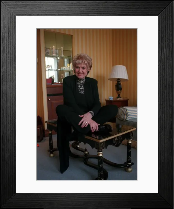 Framed Print : Gloria Hunniford TV Presenter October 1998 At home sitting on table Framed Print : Gloria Hunniford TV Presenter October 1998 At home sitting on table