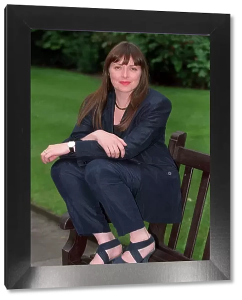 Carol Vorderman TV Presenter June 1997 Sitting on park bench A©mirrorpix