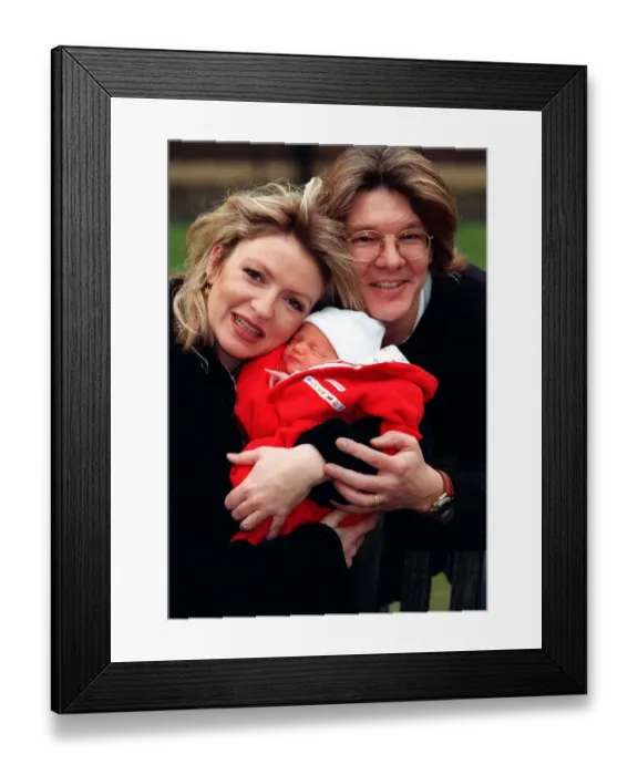 Framed Print : Television Presenter Caron Keating holding baby Gabriel with husband Russ Lindsay January Framed Print : Television Presenter Caron Keating holding baby Gabriel with husband Russ Lindsay January