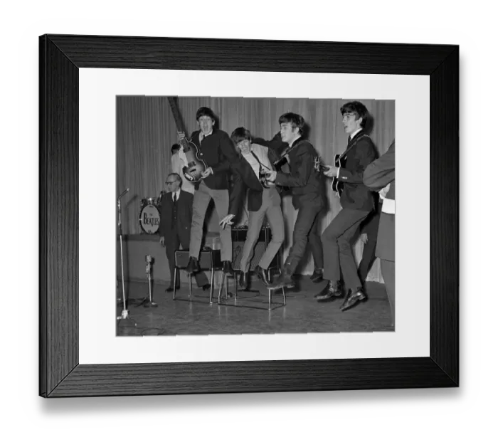 Framed Print : The Beatles play about and jump in the air during the rehearsals for the Royal Variety