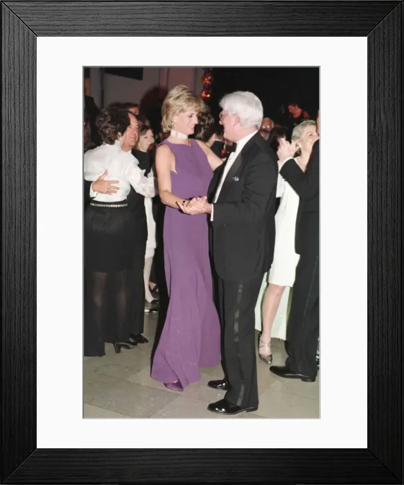 Framed Print : Princess Diana dances with American chat show host Phil Donahue at a charity gala dinner Framed Print : Princess Diana dances with American chat show host Phil Donahue at a charity gala dinner