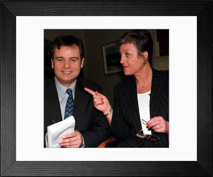 Framed Print : TV Presenter Eamonn Holmes swaps places with his PA Gill Stacey at the launch of the new Framed Print : TV Presenter Eamonn Holmes swaps places with his PA Gill Stacey at the launch of the new