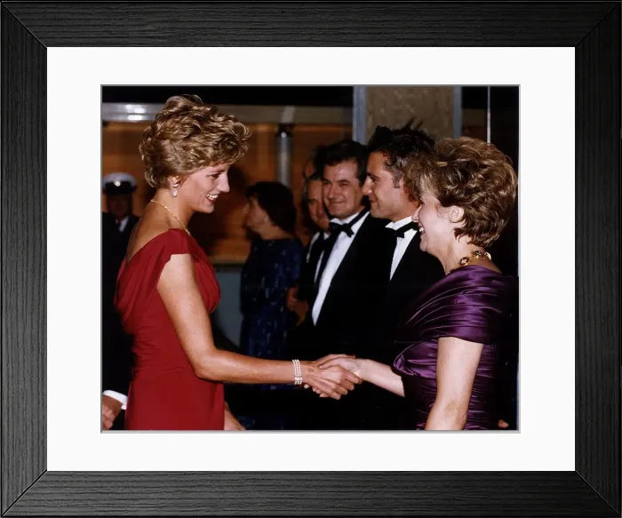 Framed Print : Diana, Princess of Wales shakes hands with actress Julie Walters as she attends Framed Print : Diana, Princess of Wales shakes hands with actress Julie Walters as she attends