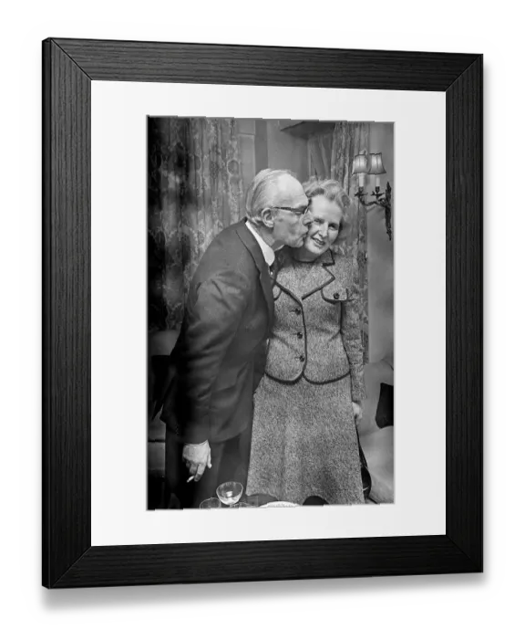 Framed Print : Margaret Thatcher with Denis Thatcher - February 1975 who kisses her on the cheek Framed Print : Margaret Thatcher with Denis Thatcher - February 1975 who kisses her on the cheek