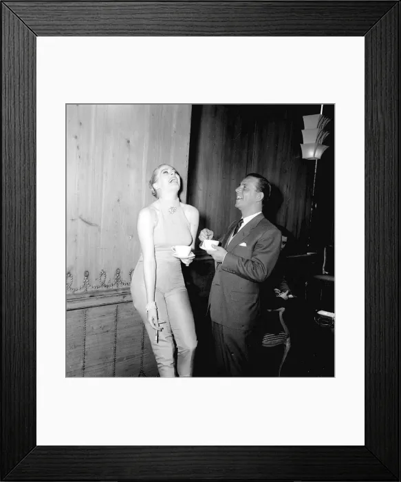 Framed Print : Actor and comedian Norman Wisdom with actress Anita Ekberg at the savoy Hotel in London