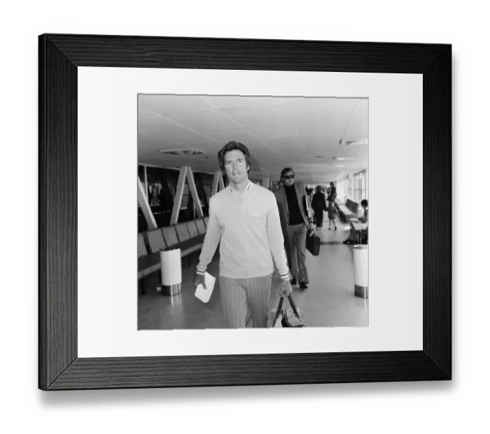 Framed Print : Clint Eastwood Actor at Heathrow Airport in London. He has been filming a thriller in