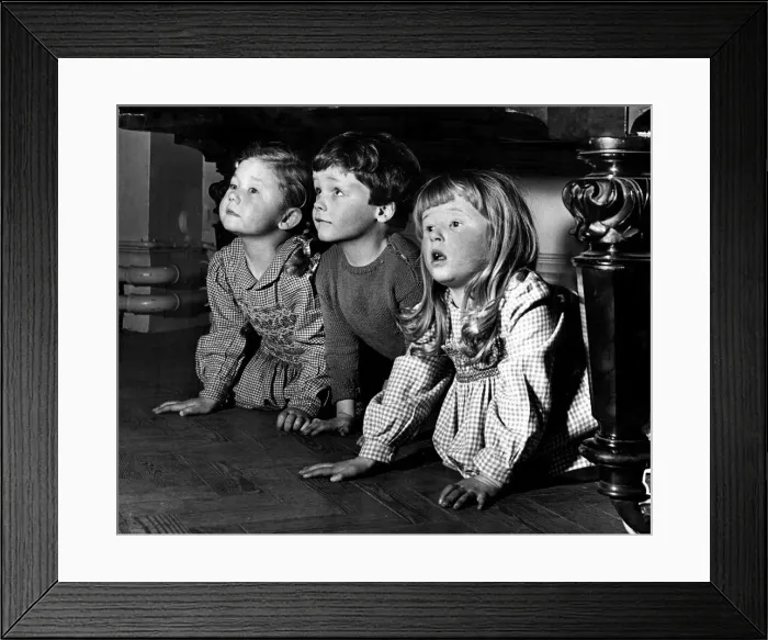 Framed Print : Three children hide underneath a piano Framed Print : Three children hide underneath a piano