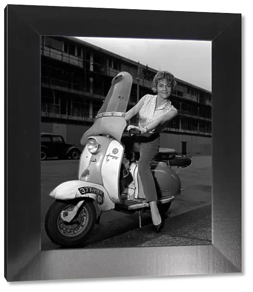 Actress Sheila Hancock sitting on a scooter April 1961