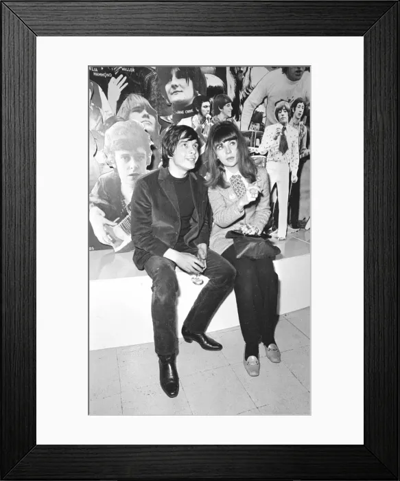 Framed Print : Christine Shrimpton with David Bailey. sitting in front of Photographic montage Framed Print : Christine Shrimpton with David Bailey. sitting in front of Photographic montage