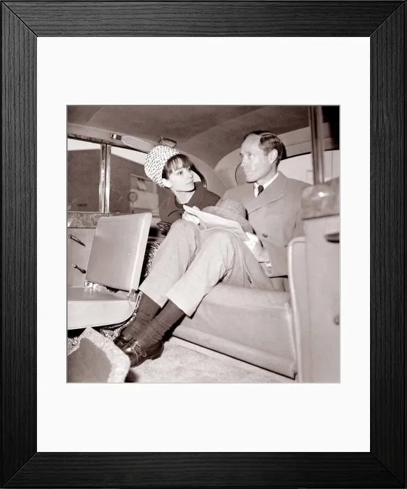 Framed Print : Actress Audrey Hepburn with husband Mel Ferrer in the back seat of a car April 1964 Framed Print : Actress Audrey Hepburn with husband Mel Ferrer in the back seat of a car April 1964
