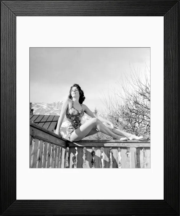 Framed Print : Winter Olympic Games 1956 A model wearing swimwear posing on a balcony