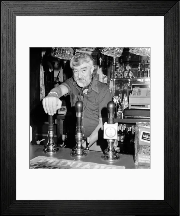 Framed Print : Ivan Beavis, a Coronation Street actor, working as a barman in the Harrow off Fleet