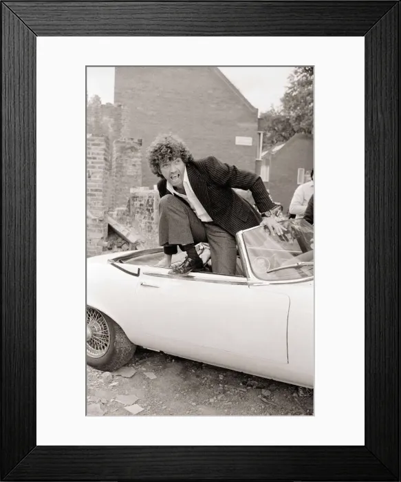 Framed Print : Martin Shaw Jumping out of a white convertable car on the set of The Professionals Framed Print : Martin Shaw Jumping out of a white convertable car on the set of The Professionals