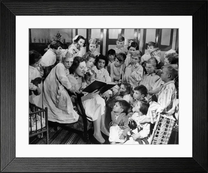Framed Print : Reading a bedtime stoyry is just the thing the house mothers do to make everything as Framed Print : Reading a bedtime stoyry is just the thing the house mothers do to make everything as
