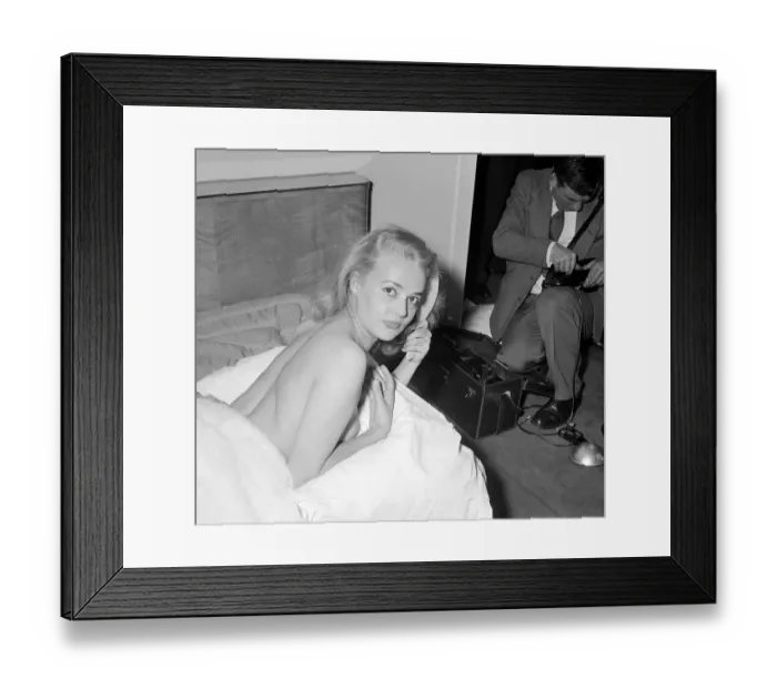 Framed Print : Actress Jeanne Moreau having her picture taken on a hotel bed July 1956 Framed Print : Actress Jeanne Moreau having her picture taken on a hotel bed July 1956