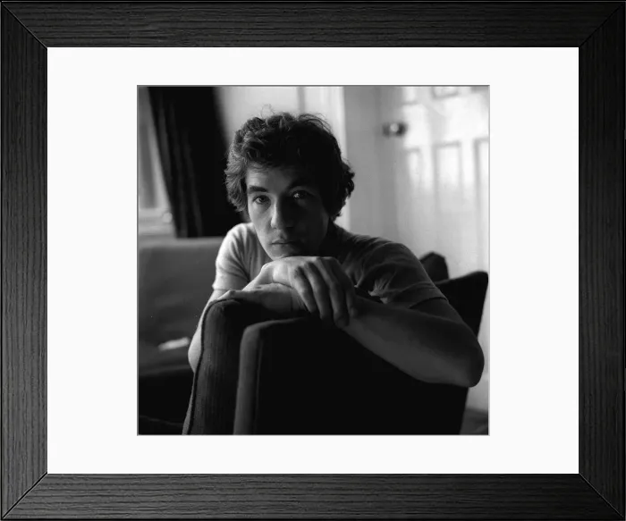 Framed Print : Ian McKellen actor sitting on chair arm over the back hands together Framed Print : Ian McKellen actor sitting on chair arm over the back hands together