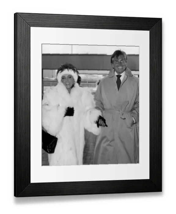 Framed Print : Elizabeth Taylor actress and George Hamilton at Heathrow Airport leaving for New York