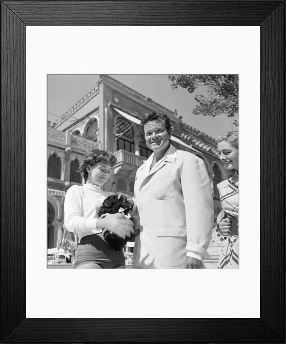 Framed Print : Orson Welles actor director and Rosy Mazzacurati relaxing in Venice September Framed Print : Orson Welles actor director and Rosy Mazzacurati relaxing in Venice September