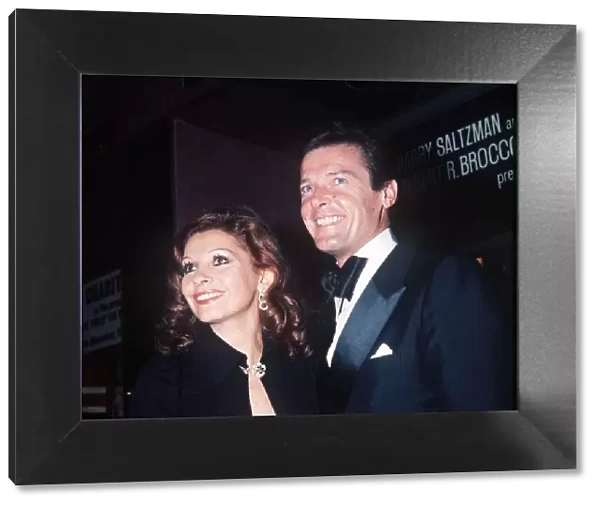 Roger Moore Actor and his wife Luisa at the premiere of the film The Man With The Golden