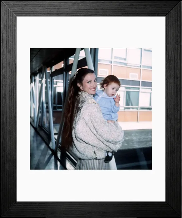 Framed Print : Jane Seymour Actress with daughter Katy at London Airport February 1983
