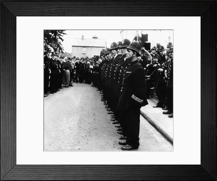 Framed Print : Norman Wisdom Comedian Actor in line with 120 policemen for the film Framed Print : Norman Wisdom Comedian Actor in line with 120 policemen for the film