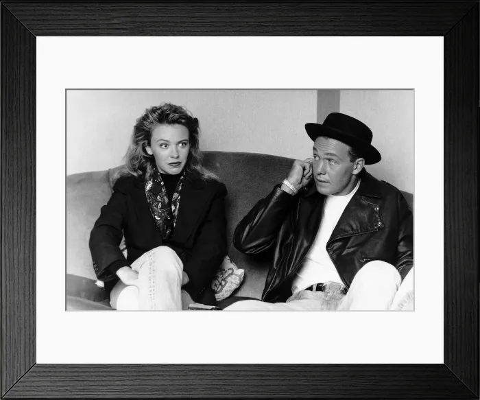 Framed Print : Kylie Minogue singer actress with Jason Donovan singer actor sitting on sofa Framed Print : Kylie Minogue singer actress with Jason Donovan singer actor sitting on sofa