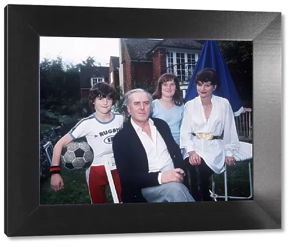 Actor George Cole at home with family October 1980