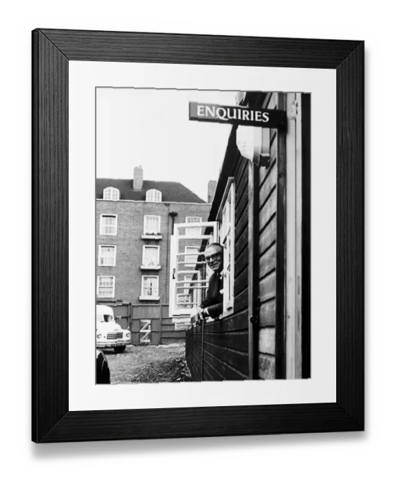 Framed Print : Sir Laurence Olivier actor at window of National Theatre offices in Duchy Street London