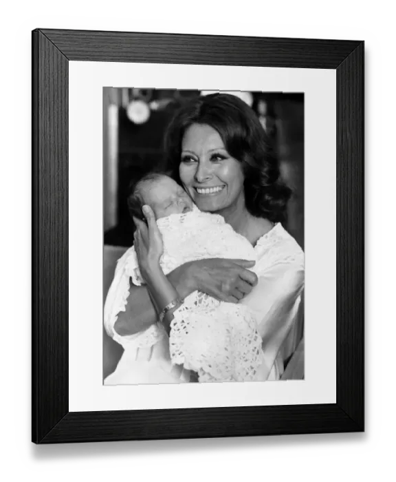 Framed Print : Actress Sophia Loren with baby Anita Cookson in August 1980