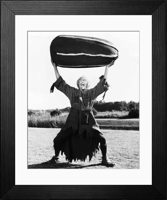 Framed Print : TV Progs Catweazle starring Geoffrey Bayldon Actor as Catweazle here holding up a giant