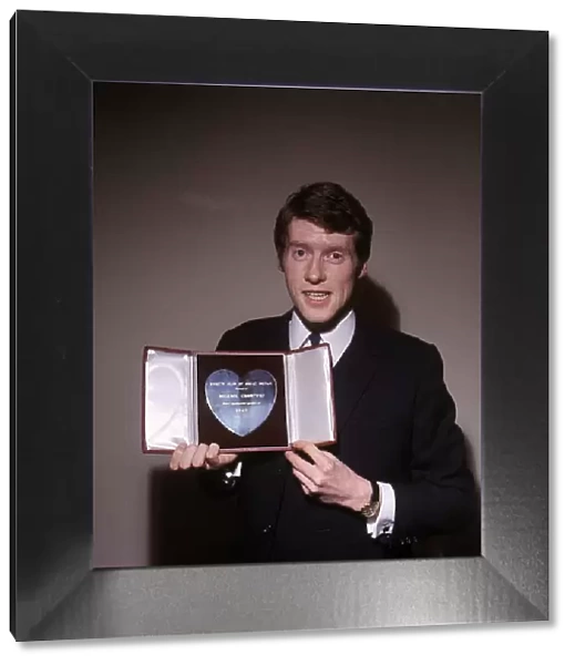 Michael Crawford Actor with his Variety Club Silver Heart Award for 1965