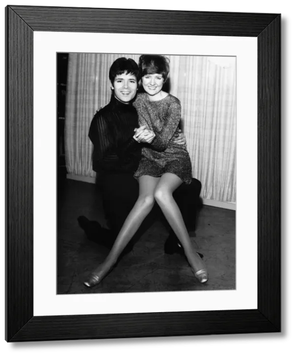 Framed Print : Cliff Richard Actor / Singer with Cilla Black sitting on his knee Framed Print : Cliff Richard Actor / Singer with Cilla Black sitting on his knee